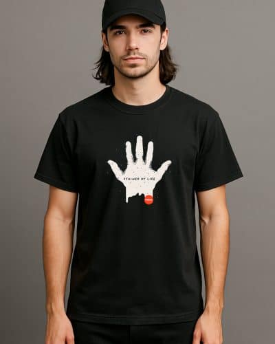 a man with long hair wearing a black shirt with a white hand on it